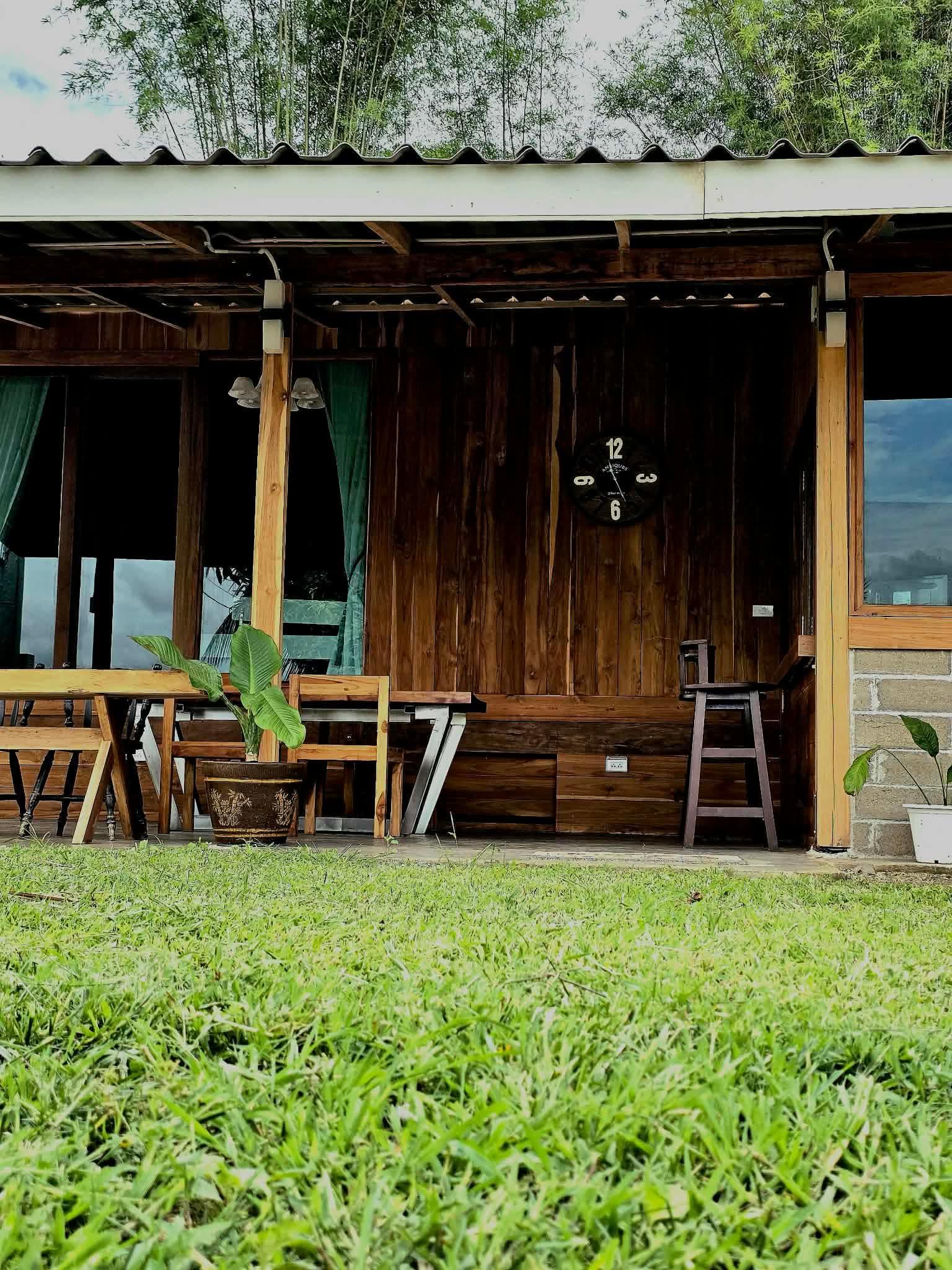 Porch and clock from the grass.